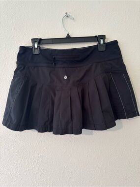 Lululemon size 10 Circuit Breaker Skirt in black with a pleated back
